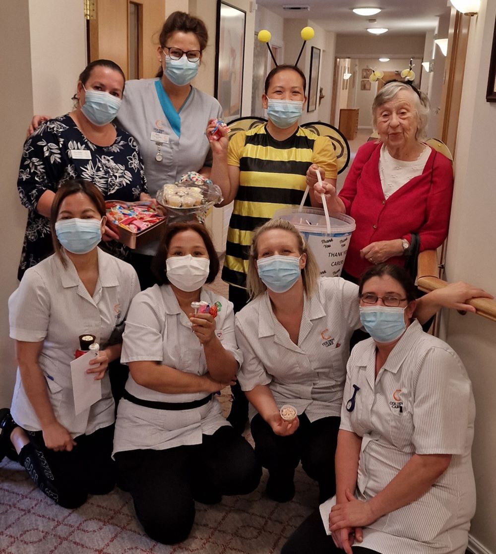 Kingfishers Home Manager Zoe Mills,  Care Coordinator Kim Gritt, Companionship Team Leader Rose Arcellana, Resident Joan Lakeman, HCA Cherry Ramos, HCA Ruby Ranches, HCA Hayley Baxter and Senior Care Lead Haylie Carr.