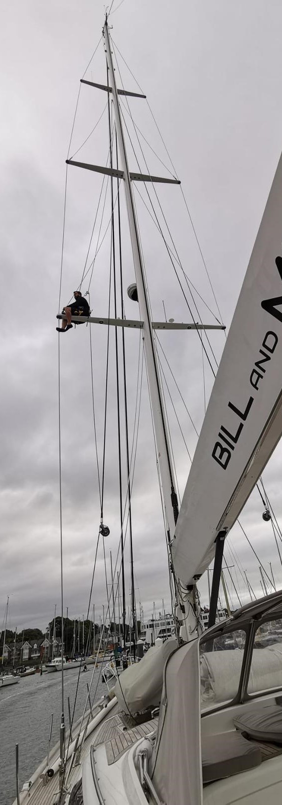 Boat rigger Declan up a yacht mast