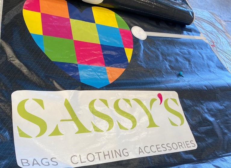 Close up photo of Sassy's branding on Yard Fees sail