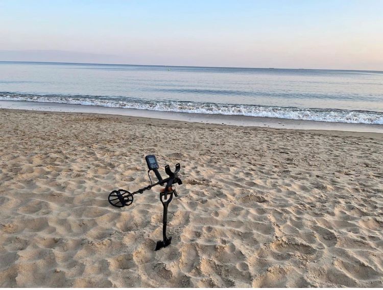 Metal detecting on the beach