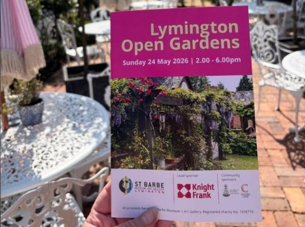 programme held in hand in garden